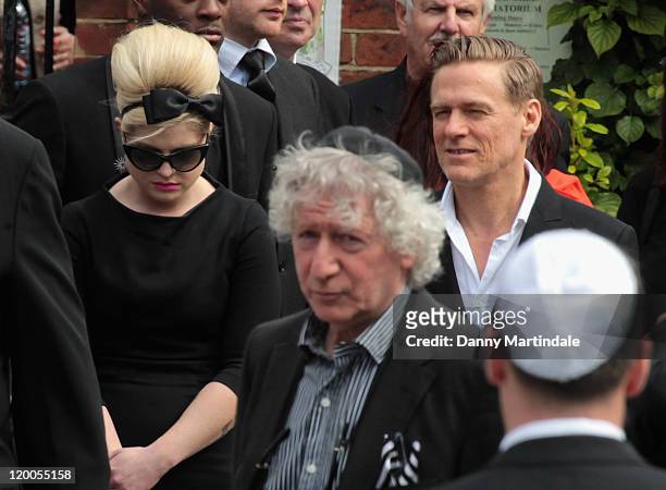 Kelly Osbourne and Bryan Adams attend a service for the cremation of Amy Winehouse at Golders Green Crematorium on July 26, 2011 in London, England.
