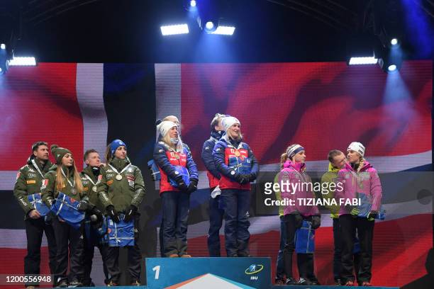 Second-placed Italy's Dominik Windisch, Italy's Dorothea Wierer, Italy's Lukas Hofer and Italy's Lisa Vittozzi, race winners Norway's Tiril Eckhoff,...