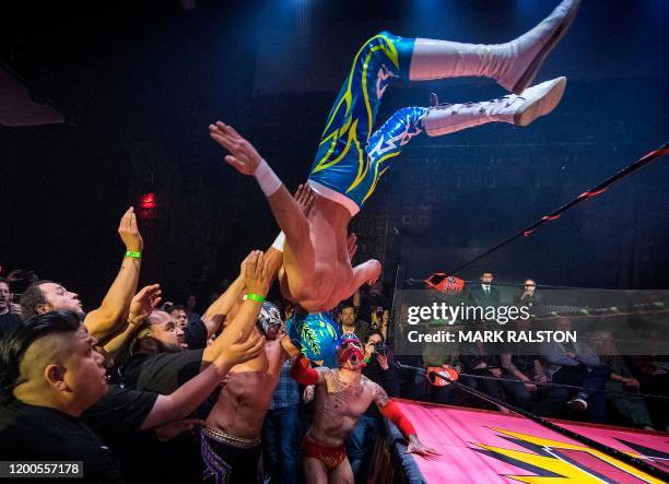 Nacho Libre wrestlers perform during the Lucha Vavoom 'Valentines Day' show at the Mayan Theatre, California, on February 12, 2020. - Lucha Vavoom...