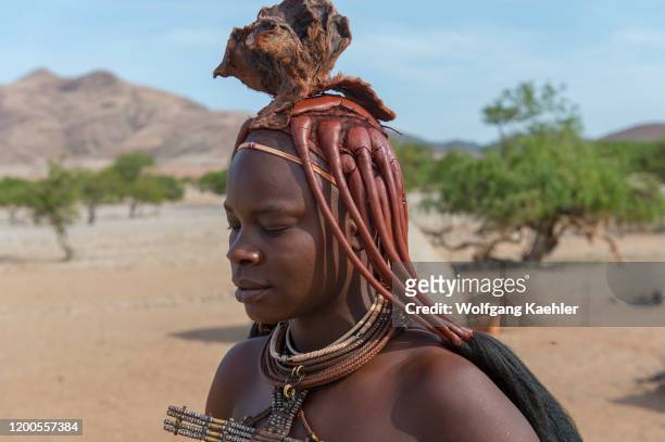 Portrait of a Himba woman in a Himba settlement in the Damaraland of northwestern Namibia.