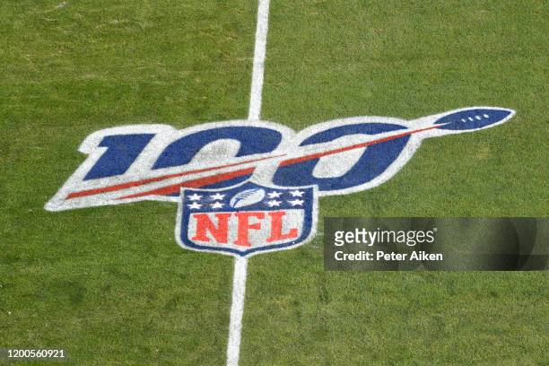 The NFL 100 year anniversary logo is seen on the field before the AFC Championship Game between the Kansas City Chiefs and the Tennessee Titans at...
