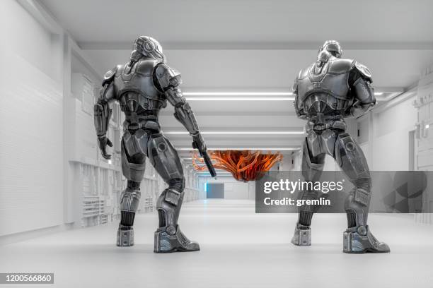 spaceship futuristic cyborg soldiers against alien intruder - fictional being stock pictures, royalty-free photos & images