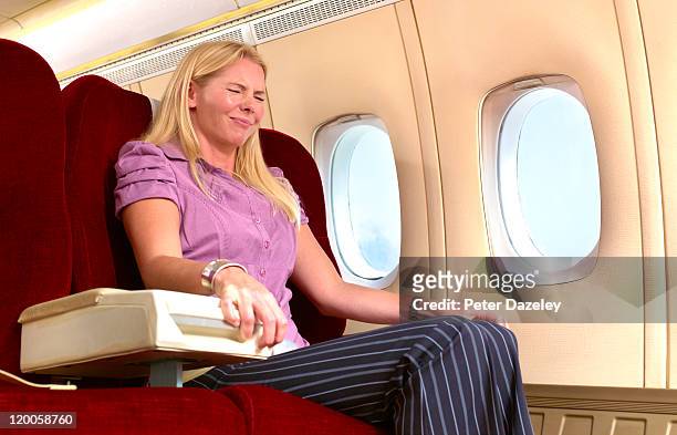 woman with fear of flying - airline seats stock pictures, royalty-free photos & images