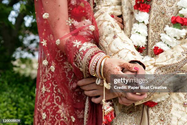 close up on hands of a married indian couple - indian festival stock pictures, royalty-free photos & images
