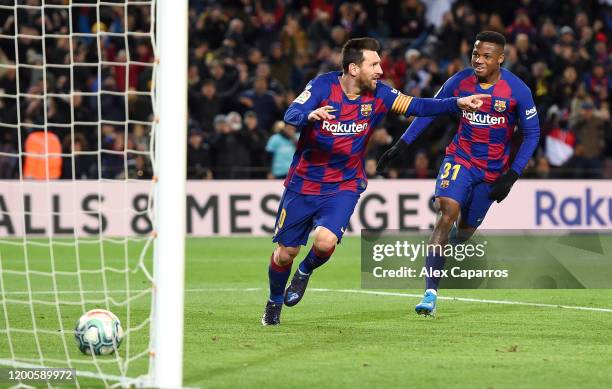 Lionel Messi of FC Barcelona celebrates after scoring his team's first goal during the La Liga match between FC Barcelona and Granada CF at Camp Nou...