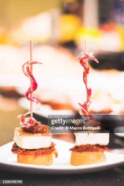 traditional basque pinchos (pintxos) snacks, san sebastian, spain - san sebastian stock-fotos und bilder