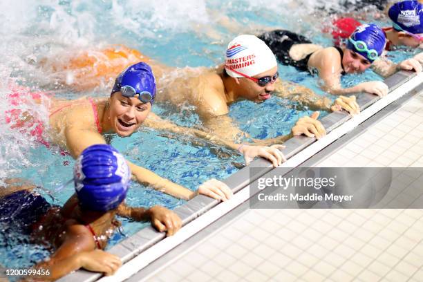 Grant Williams of the Boston Celtics participates in a swim lesson conducted by Olympic swimmer Elizabeth Beisel at Charlestown Boys & Girls Club on...