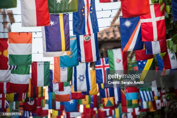 country flags bunting in cartagena - international flags stock-fotos und bilder