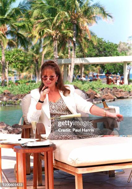 Jackie Collins author, poolside at a private bungalow June 29, 1995 at the Mauna Lani Resort, Hawaii