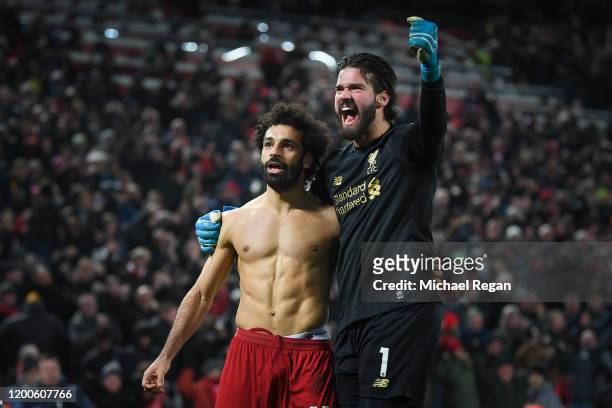 Mohamed Salah of Liverpool celebrates his goal to make it 2-0 with Alisson Becker during the Premier League match between Liverpool FC and Manchester...
