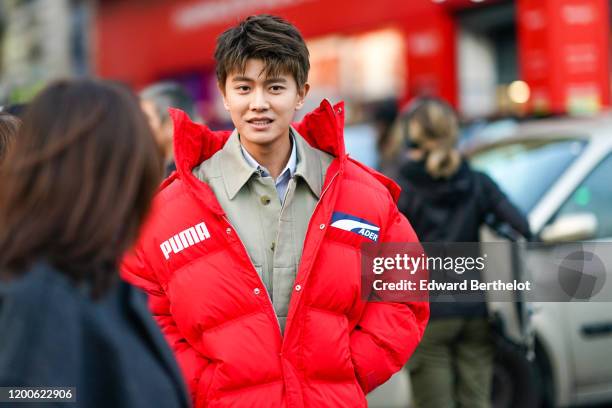 Jialun Ren wears a sand-color shirt, a red Puma puff jacket, outside Paul Smith, during Paris Fashion Week - Menswear Fall/Winter 2020-2021 on...