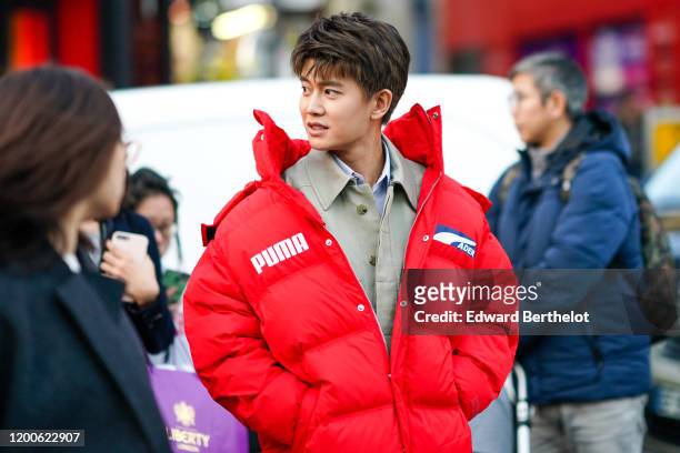 Jialun Ren wears a sand-color shirt, a red Puma puff jacket, outside Paul Smith, during Paris Fashion Week - Menswear Fall/Winter 2020-2021 on...