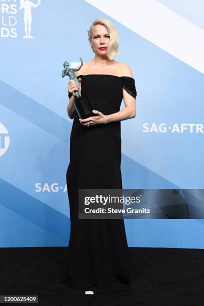 Michelle Williams poses in the press room after winning the award for Outstanding Performance by a Female Actor in a Television Movie or Limited...