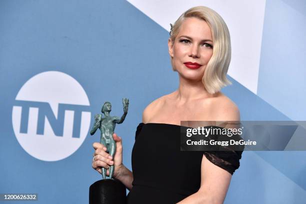 Michelle Williams poses in the press room after winning the award for Outstanding Performance by a Female Actor in a Television Movie or Limited...