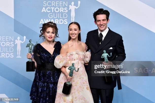 The Crown" cast Helena Bonham Carter , Josh O'Connor and Erin Doherty pose in the press room with the trophy for Outstanding Performance by an...