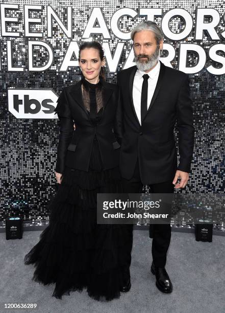 Winona Ryder and Scott Mackinlay Hahn attend the 26th Annual Screen Actors Guild Awards at The Shrine Auditorium on January 19, 2020 in Los Angeles,...