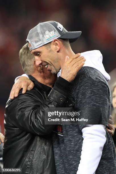 Head coach Kyle Shanahan of the San Francisco 49ers celebrates with his father, Mike Shanahan, after winning the NFC Championship game against the...