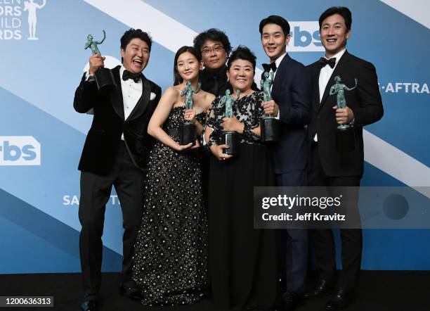 Kang-Ho Song, Park So-dam, Bong Joon-ho, Lee Jung Eun, Lee Sun-kyun and Choi Woo-shik pose in the press room after winning the award for Outstanding...