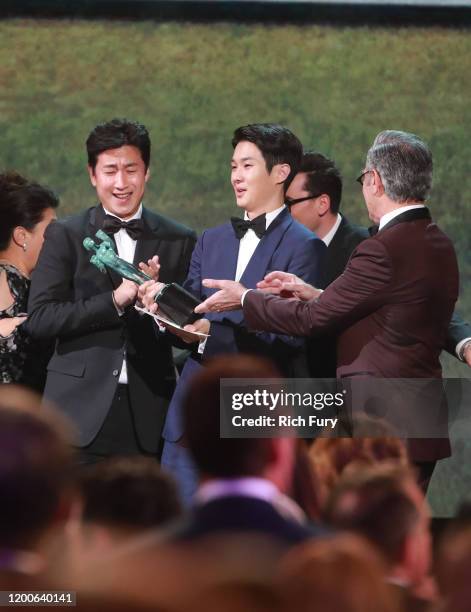 Choi Woo-shik and Lee Sun-kyun accept Outstanding Performance by a Cast in a Motion Picture for 'Parasite' onstage during the 26th Annual Screen...