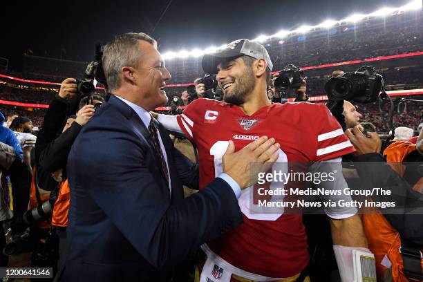 San Francisco 49ers general manager John Lynch congratulates San Francisco 49ers' quarterback Jimmy Garoppolo after winning the NFC Championship game...