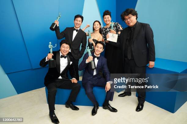 Song Kang-ho, Lee Sun-kyun, Park So-dam, Choi Woo-shik, Lee Jeong-eun, and Bong Joon-ho, winner of the Outstanding Performance by a Cast in a Motion...