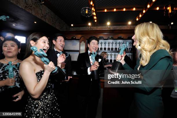 Park So-dam, Lee Sun Kyun, Song Kang Ho, winners of Outstanding Performance by a Cast in a Motion Picture for 'Parasite', pose with Laura Dern,...