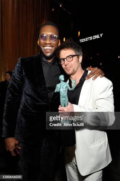 Mahershala Ali and Sam Rockwell, winner for best actor award in a TV movie or television miniseries for "Fosse/Verdon" pose in the trophy room during...
