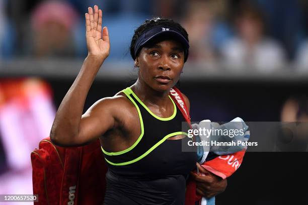 Venus Williams of the United States of America waves to the crowd after losing her Women's Singles first round match against Coco Gauff of the United...