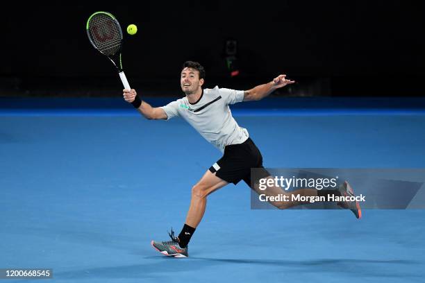 Juan Ignacio Londero of Argentina plays a forehand during his Men's Singles first round match against Grigor Dimitrov of Bulgaria on day one of the...