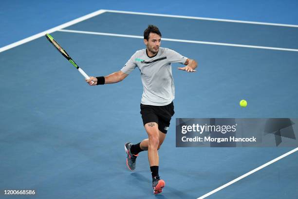 Juan Ignacio Londero of Argentina plays a forehand during his Men's Singles first round match against Grigor Dimitrov of Bulgaria on day one of the...