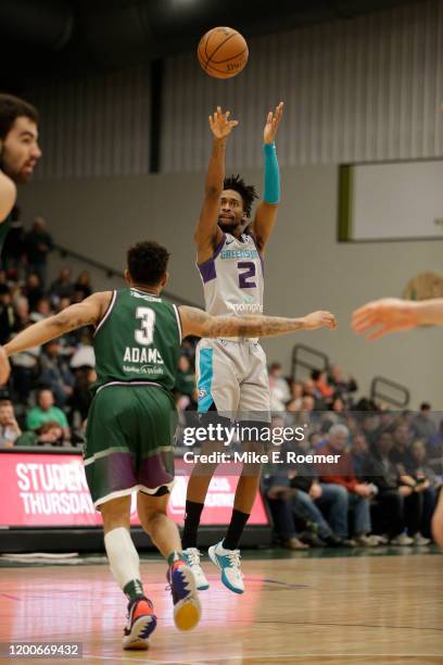 February 13: Greensboro Swarm guard Kobi Simmons shoot over the defense of Wisconsin Herd guard Jaylen Adams in a NBA G-League game on February 13,...