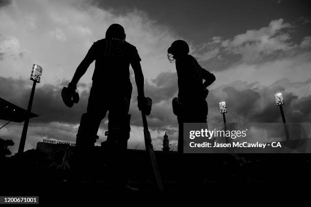 Josh Philippe of the Sixers and Daniel Hughes of the Sixers prepare to walk onto the pitch during the Big Bash League match between the Sydney Sixers...