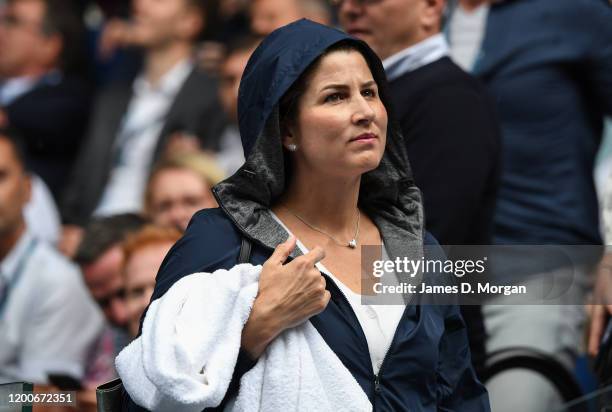 Mirka Federer, wife of Roger Federer puts on her rain jacket on Rod Laver Arena during a rain delay on day one of the 2020 Australian Open at...