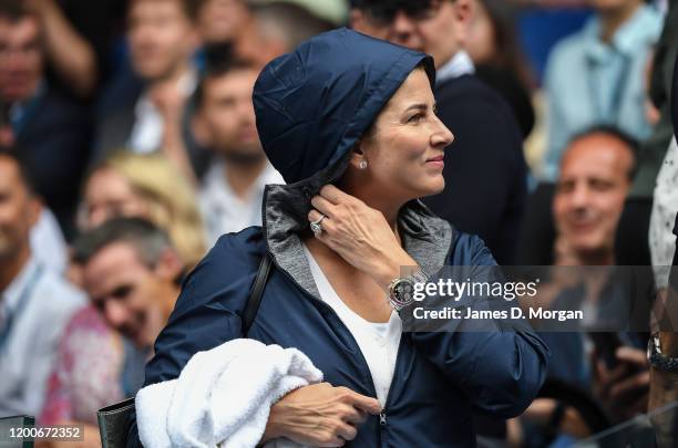 Mirka Federer, wife of Roger Federer puts on her rain jacket on Rod Laver Arena during a rain delay on day one of the 2020 Australian Open at...