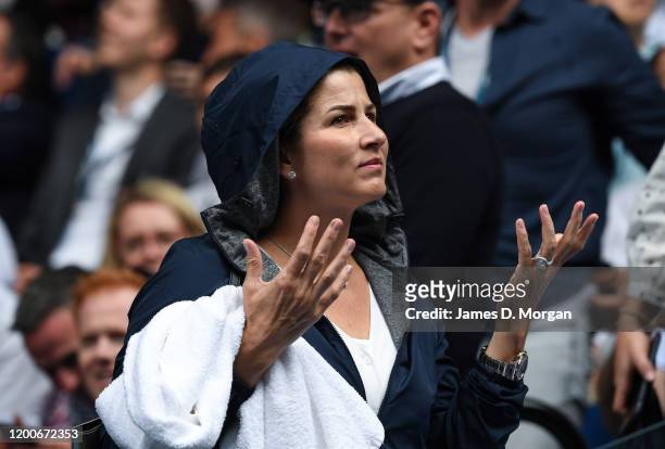 Mirka Federer, wife of Roger Federer puts on her rain jacket on Rod Laver Arena during a rain delay on day one of the 2020 Australian Open at...