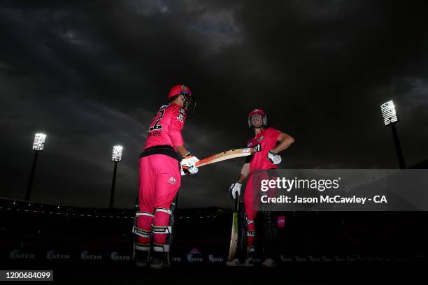 Josh Philippe of the Sixers and Daniel Hughes of the Sixers prepare to take to the pitch during the Big Bash League match between the Sydney Sixers...