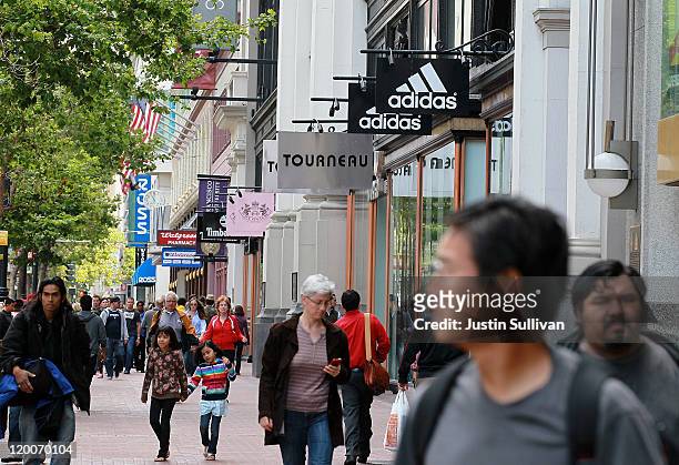People walk by retail stores along Market Street on July 29, 2011 in San Francisco, California. The U.S. Commerce Department reported today that the...