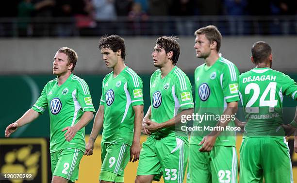 Patrick Ochs, Srdjan Lakic, Patrick Helmes, and Marco Russ of Wolfsburg look dejected after the DFB Cup first round match between RB Leipzig and VfL...