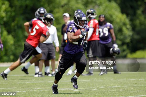 Running back Ray Rice of the Baltimore Ravens carries the ball during drills at the teams training camp on July 29, 2011 in Owings Mills, Maryland.