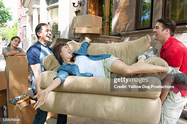 young adults taking a break while moving - moving funny stock pictures, royalty-free photos & images