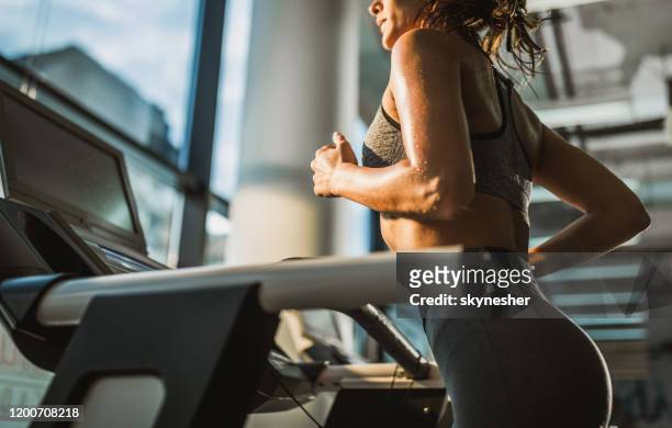jogging on treadmill in a gym! - health club stock pictures, royalty-free photos & images