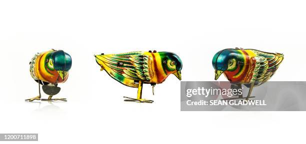 wind-up tin plate toy - clockwork toy stock pictures, royalty-free photos & images