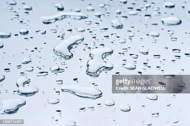 clean water on mirror - raindrop stock pictures, royalty-free photos & images