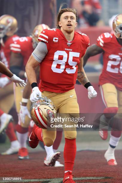 George Kittle of the San Francisco 49ers runs onto the field prior to the NFC Championship game against the Green Bay Packers at Levi's Stadium on...