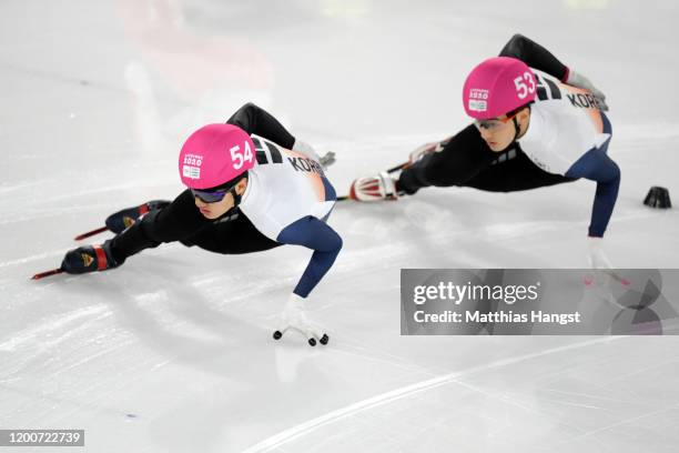 Jeongmin Lee of South Korea and Sungwoo Jang of South Korea compete in their Men's 500m Quarterfinal Run in short track speed skating during day 11...