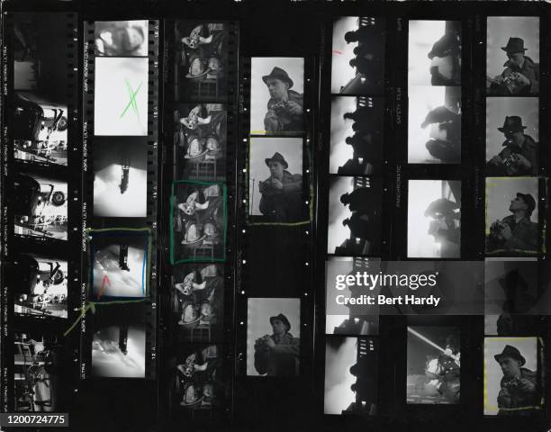 Contact sheet from a Picture Post magazine story depicting firefighters tackling a blaze during the Blitz, London, 1941; the images include portraits...