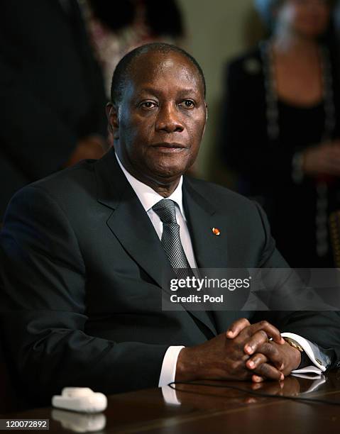 President Alassane Ouattara of the Ivory Coast sits during meeting with U.S. President Barack Obama and other African leaders in the Cabinet Room of...