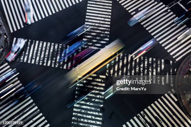 motion speed light tail of a crossing in ginza at night, tokyo, japan - zebra crossing abstract stock pictures, royalty-free photos & images