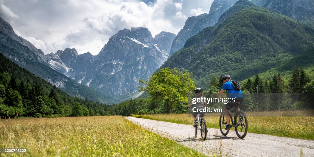 Father and son on a cycling trip to the mountains