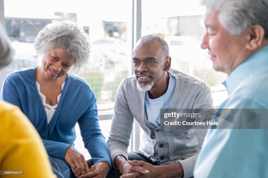 Adults Getting Support Senior Adults Coming Together At A Support Group And Listening ...